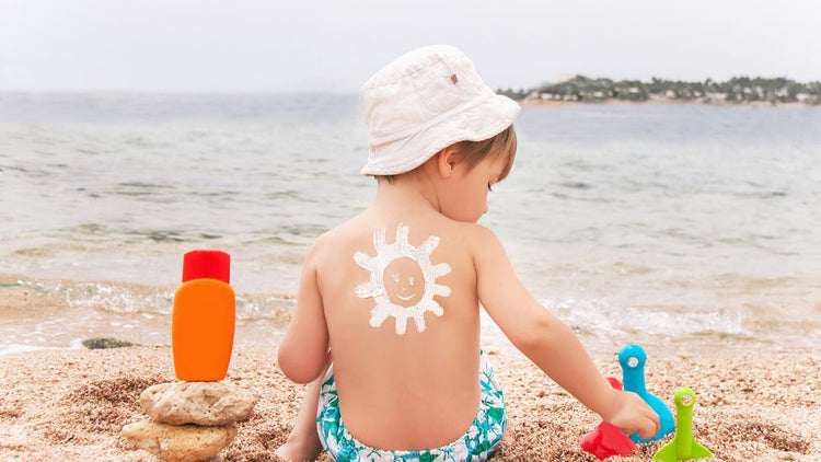 Baby wearing a sun hat outdoors for summer sun protection