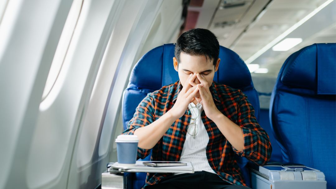 travel sickness airplane passenger