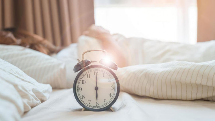 Autumn clock change and sleep schedule with an alarm clock in a cosy bedroom