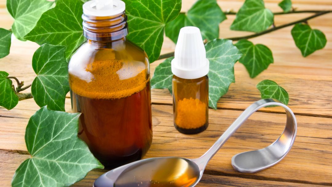 Cough syrup bottles with honey and lemon illustrating chesty and dry cough relief.