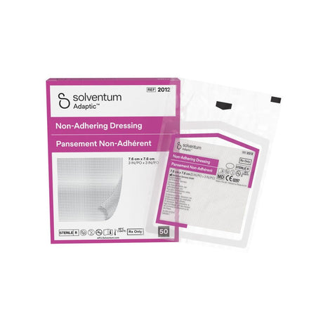 Solventum Adaptic Non-Adhering Dressing packaging and a single clear dressing packet on a white background.