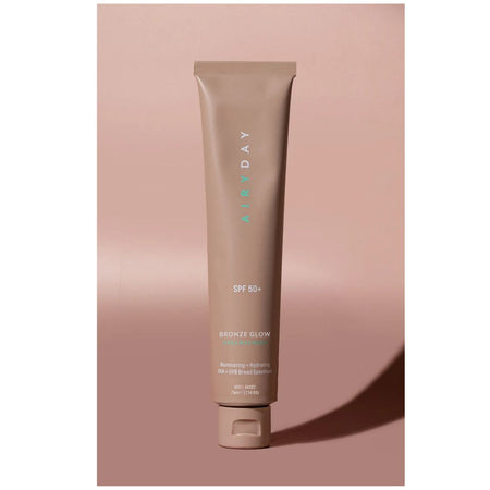 Airyday Bronze Glow SPF50+ Dreamscreen on a pink background