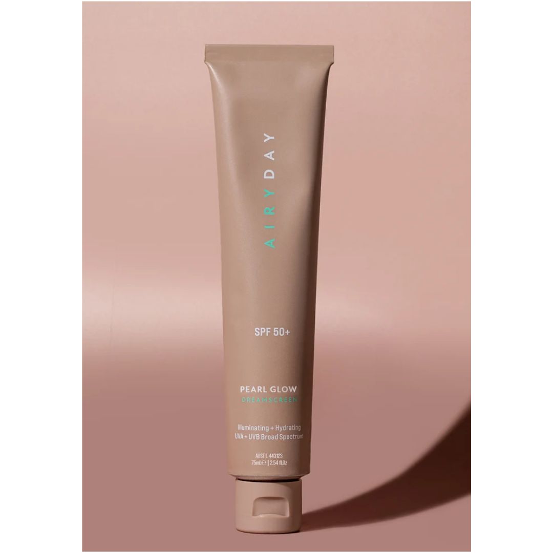 Airyday Pearl Glow SPF50+ Dreamscreen tube on a pink background