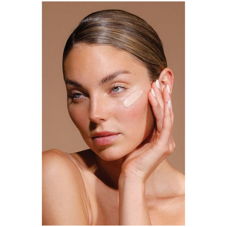 Airyday Pretty in Zinc SPF50+ Dreamscreen image of woman with a smear of the product on her cheek