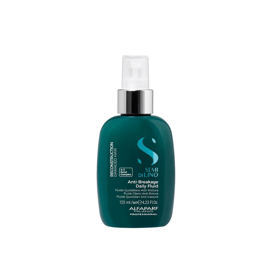 A bottle of Alfaparf Semi Di lino Anti-Breakage Daily Fluid hair care product in a dark teal-green color with a silver pump and white cap, on a plain white background.