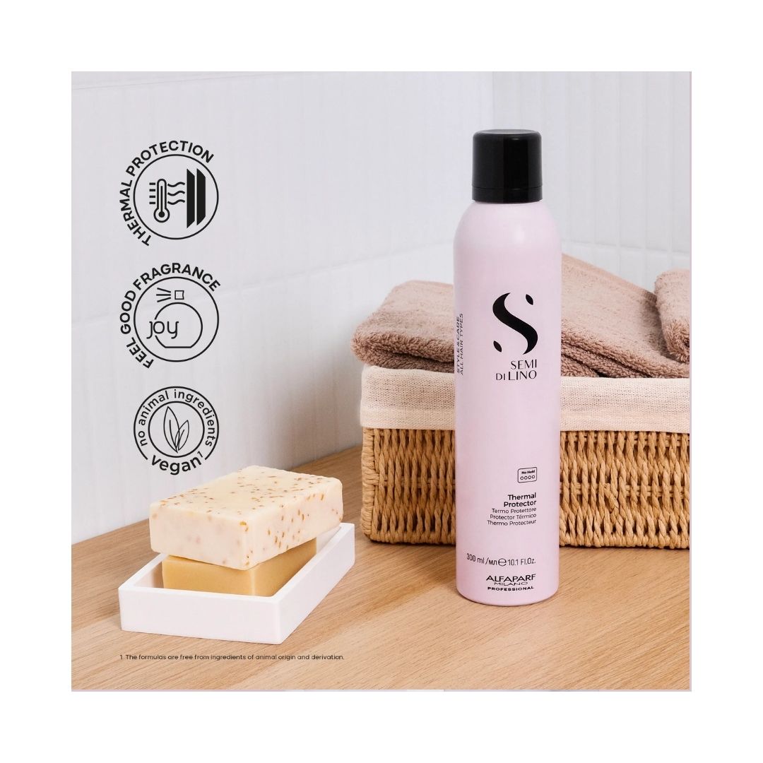 Alfaparf Milano Semi di Lino Thermal Protector 300ml on a bathroom counter top with soap and a basket of towels
