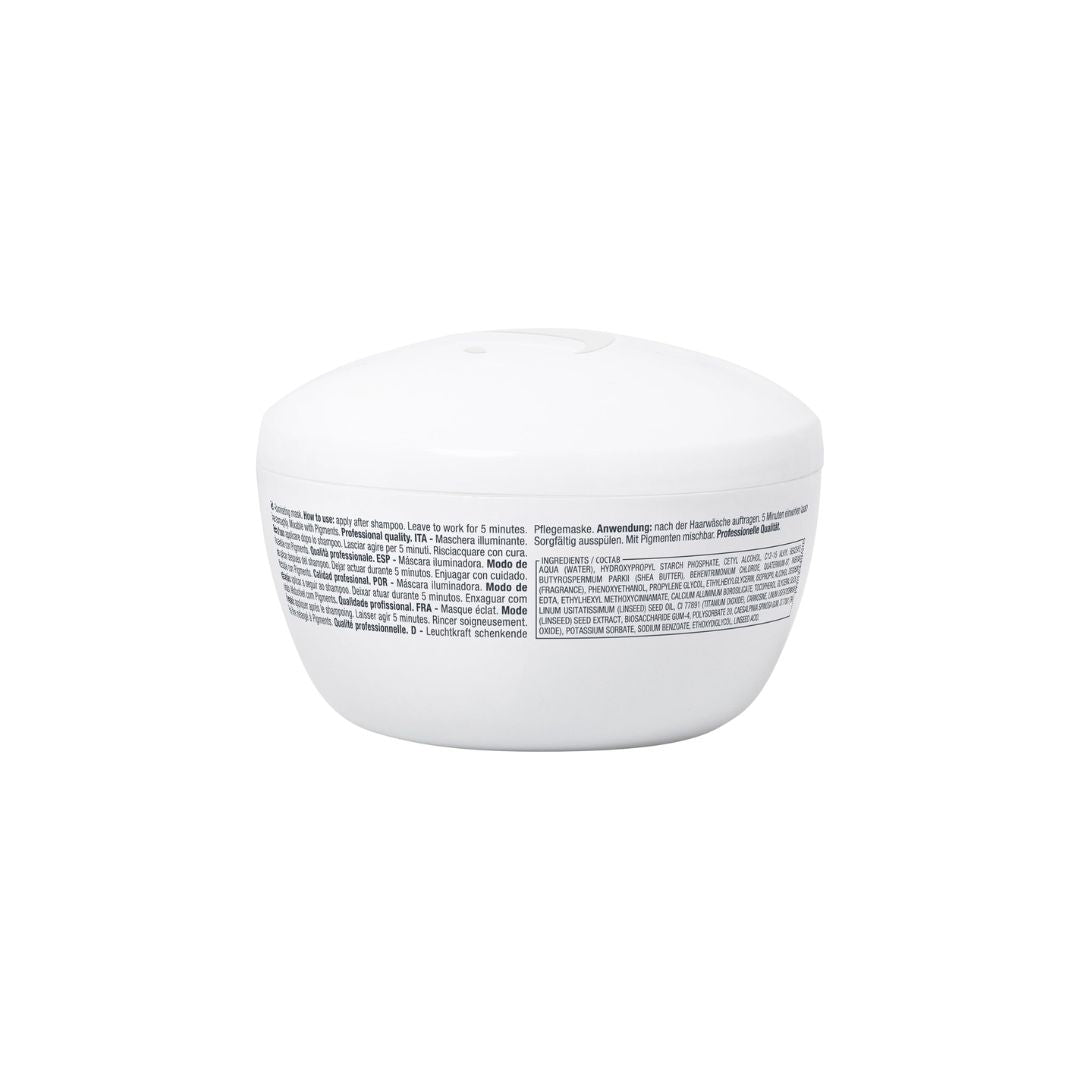A white cosmetic jar with a matching lid, shown from the back to display the fine print text on the label, set against a plain white background.