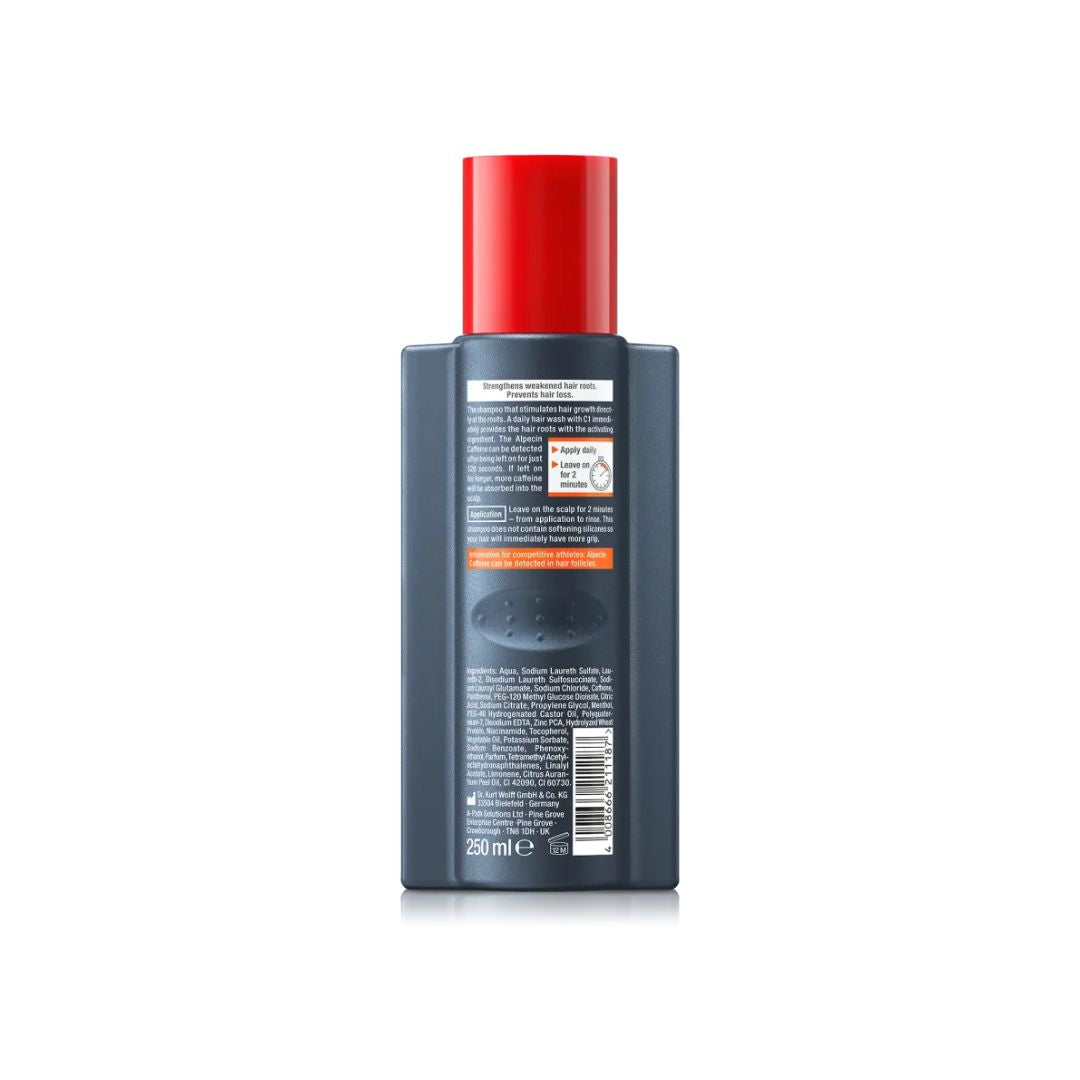 A dark gray rectangular bottle with a bright red cap, showing the back label in white text, photographed on a clean white background.