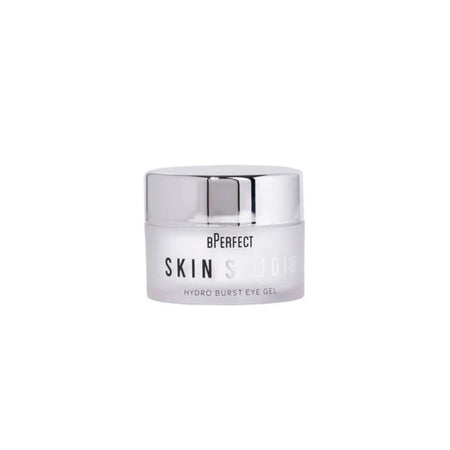 A small cosmetic jar of BPerfect Skin Studio Hydro Burst Eye Gel with a reflective silver lid and a frosted white container, centered on a plain white background.