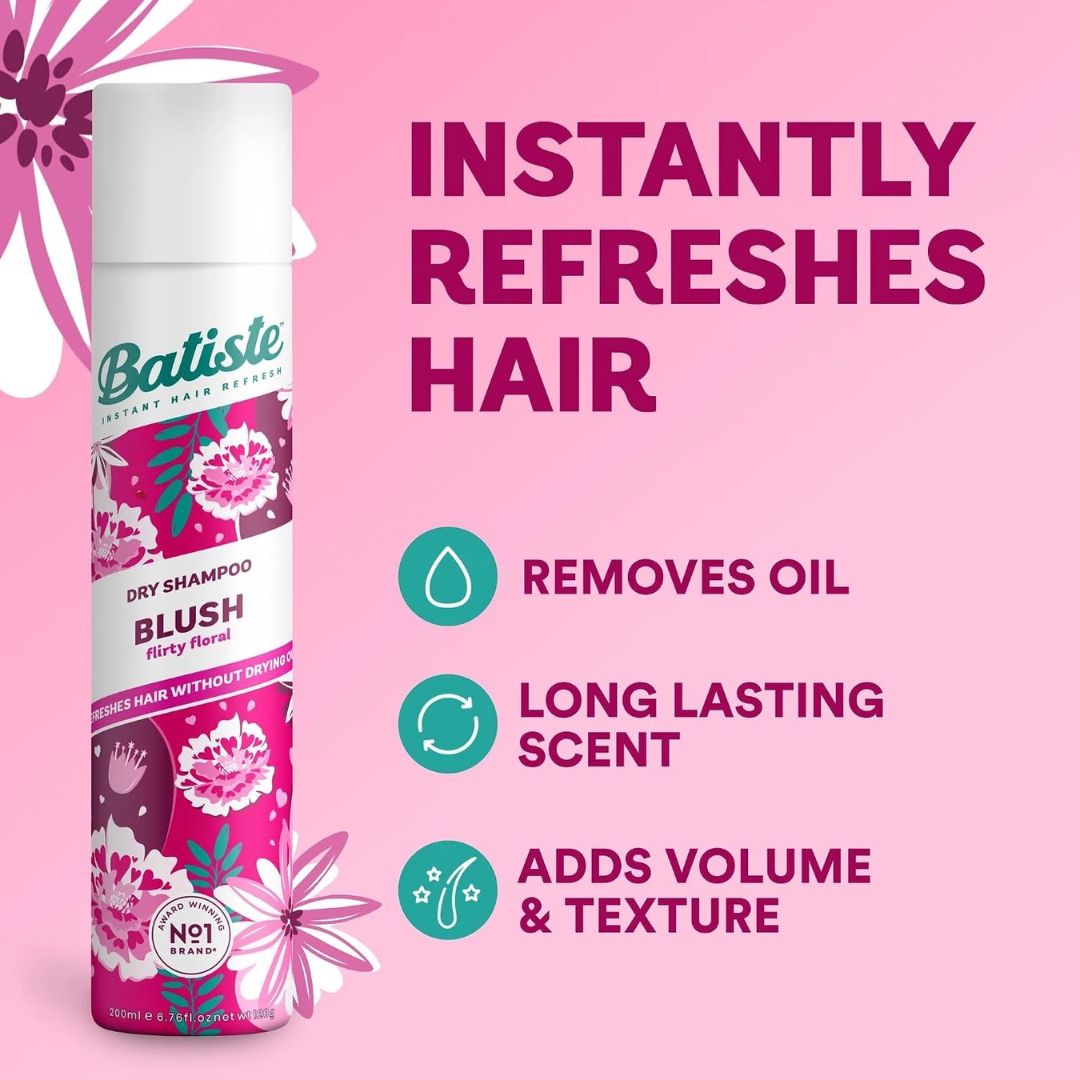 Batiste Dry Shampoo in the Blush floral scent, shown on a pink background with promotional text and icons highlighting its oil removal, lasting scent, and volume-adding properties.