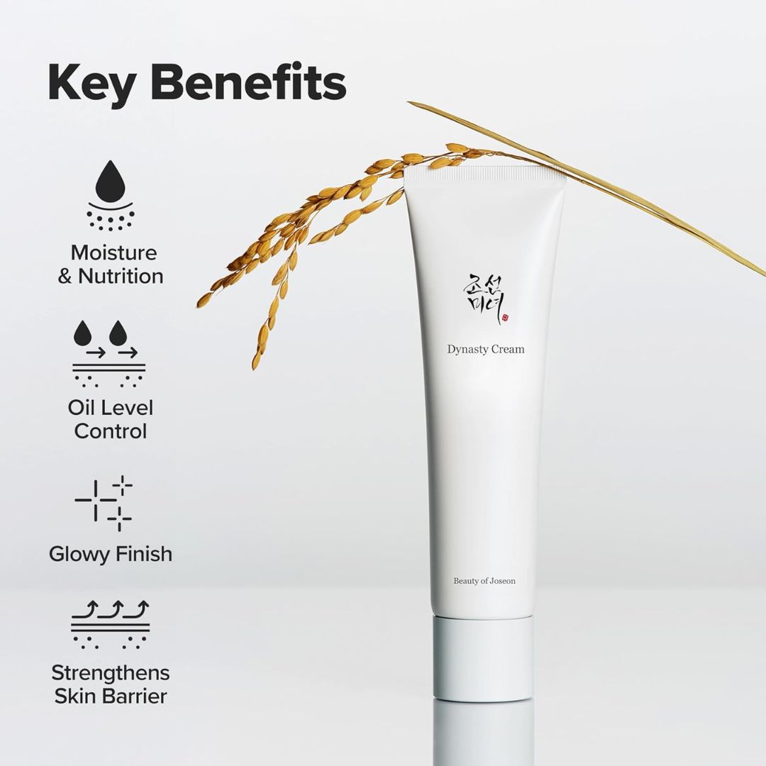 Beauty of Joseon Dynasty Cream in a white squeeze tube, displayed next to a golden rice stalk on a light gray background with 'Key Benefits' text and icons on the left.