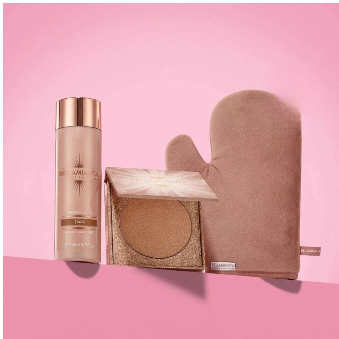 A three-piece self-care beauty set from Illuminating on a pink background, featuring a Beamiya Toner bottle, a glittery bronzer compact, and a plush dusty pink washcloth.