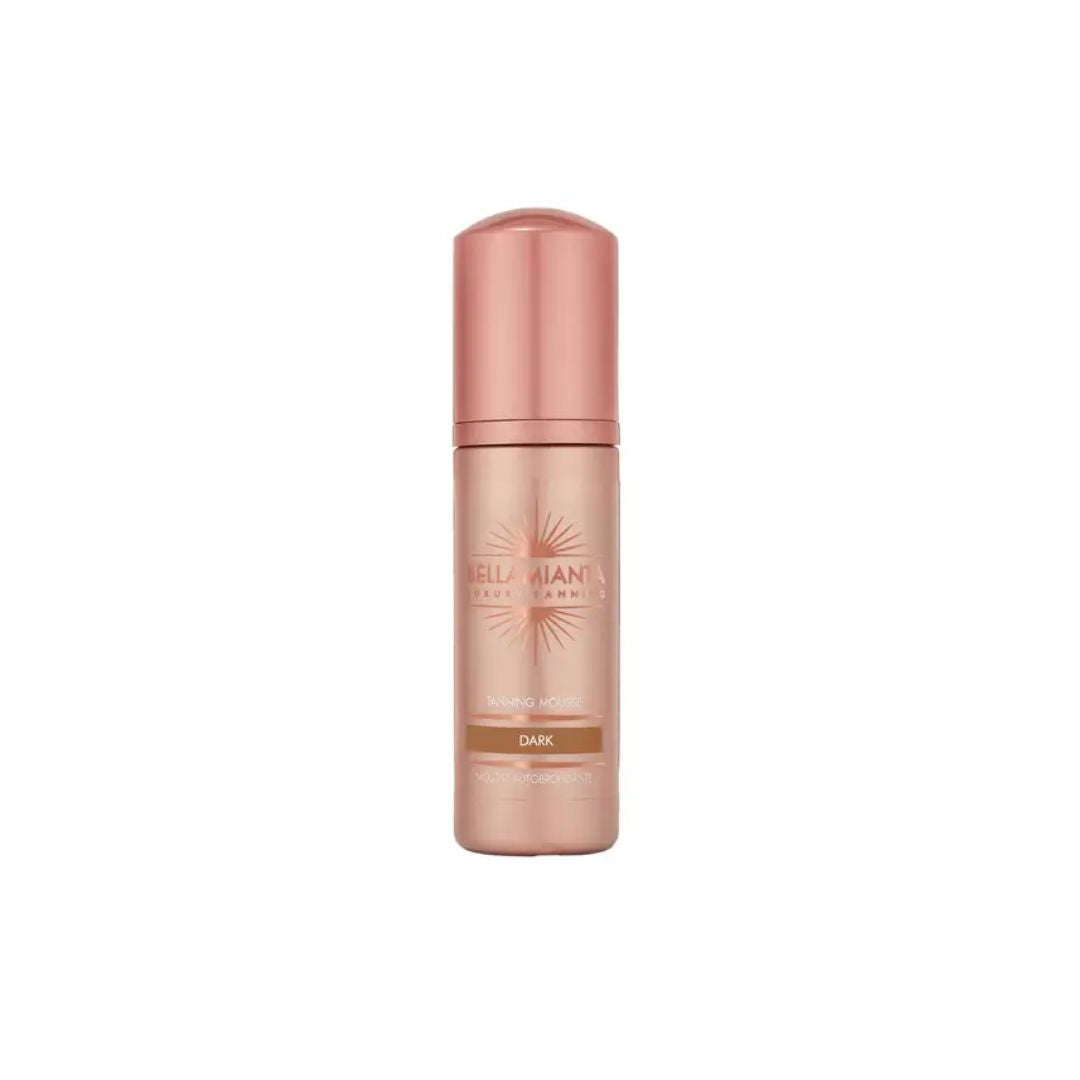 Bella Manteca Milano Shimmer Mousse in the shade Dark, presented in a metallic rose gold cylindrical bottle with a matching cap on a solid white background.