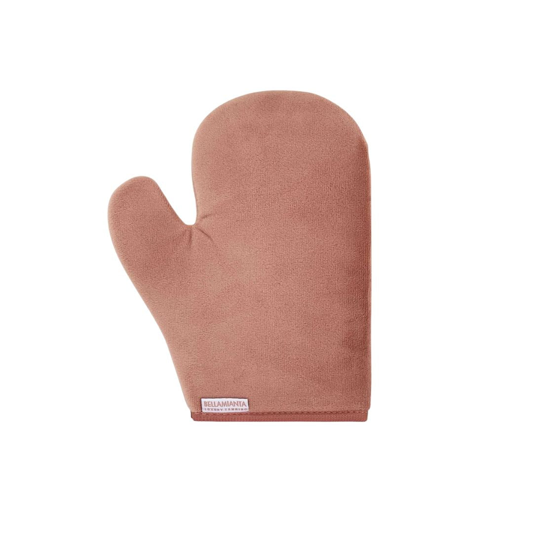 A dusty rose silicone oven mitt with a small white brand label at the bottom, shown on a plain white background.