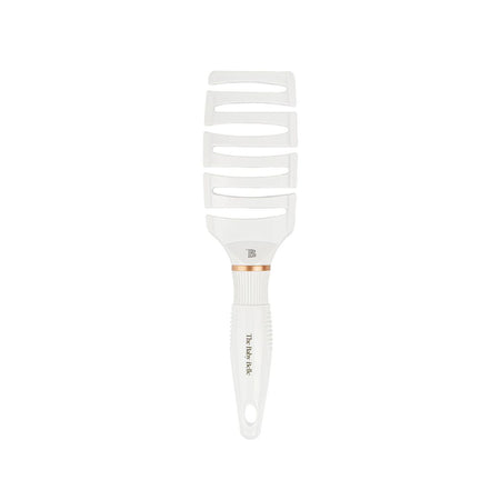 A white plastic wide-tooth comb with a ribbed handle and a thin rose gold accent band, shown against a plain white background.