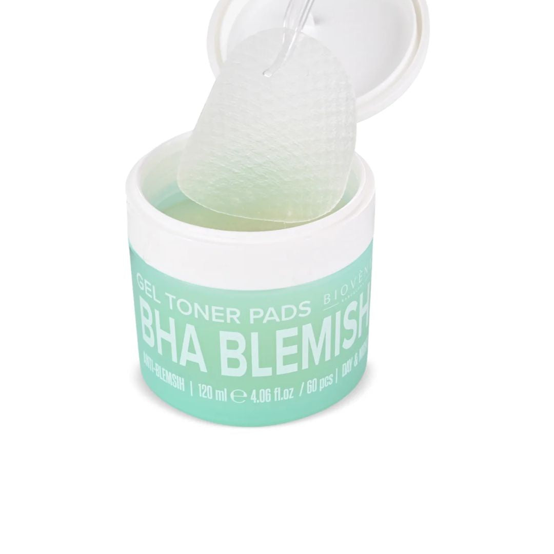 A jar of BHA Blemish Gel Toner Pads with the lid open, showing a translucent, textured gel pad being lifted out. The product is in a white jar with a mint green label.