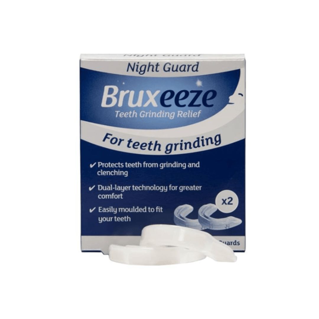 A box of Bruxeeze Teeth Grinding Relief Night Guard, with two white curved night guards placed in front on a plain white background.