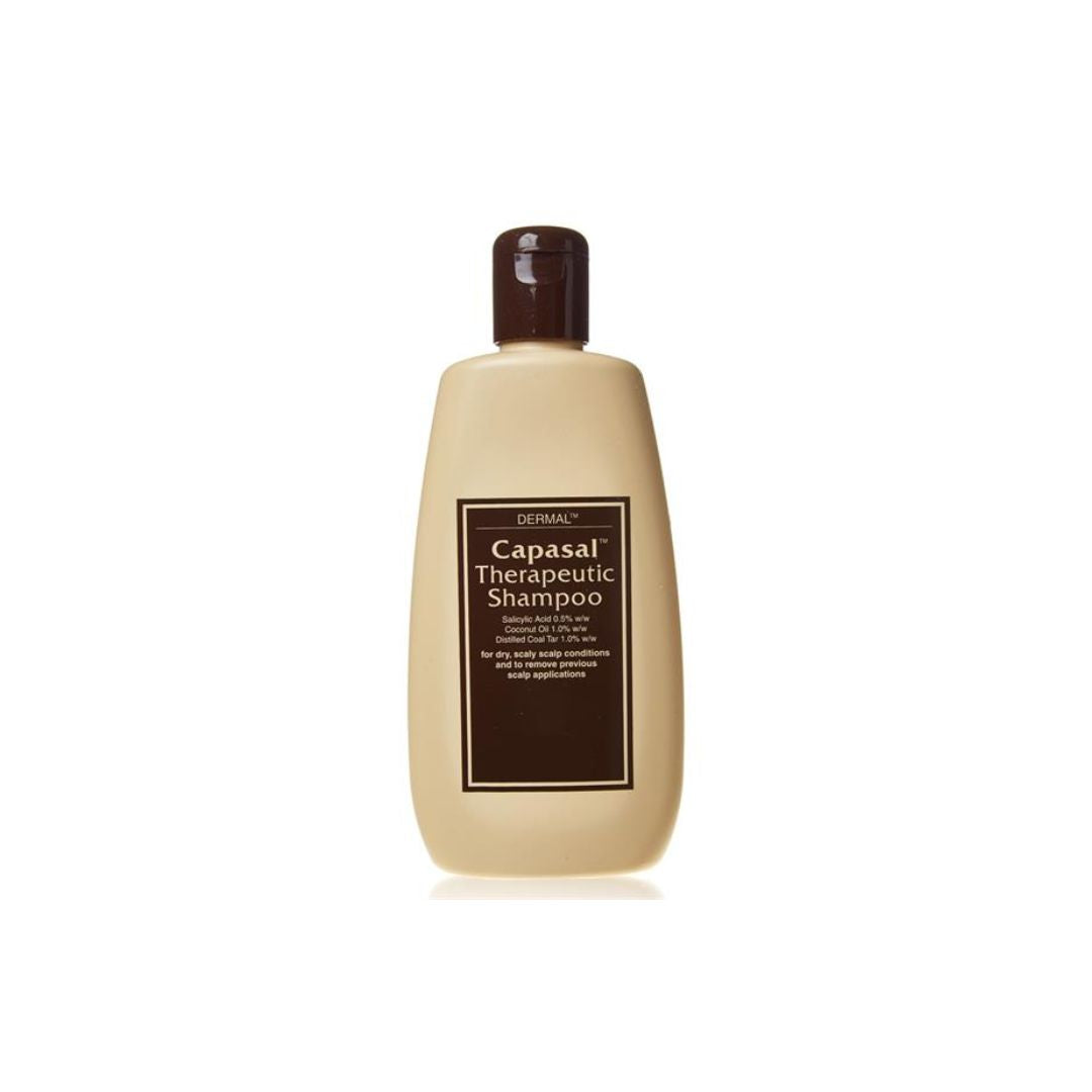 A bottle of Dermal Capasal Therapeutic Shampoo with a beige body, dark brown cap, and a dark brown label, centered on a white background.
