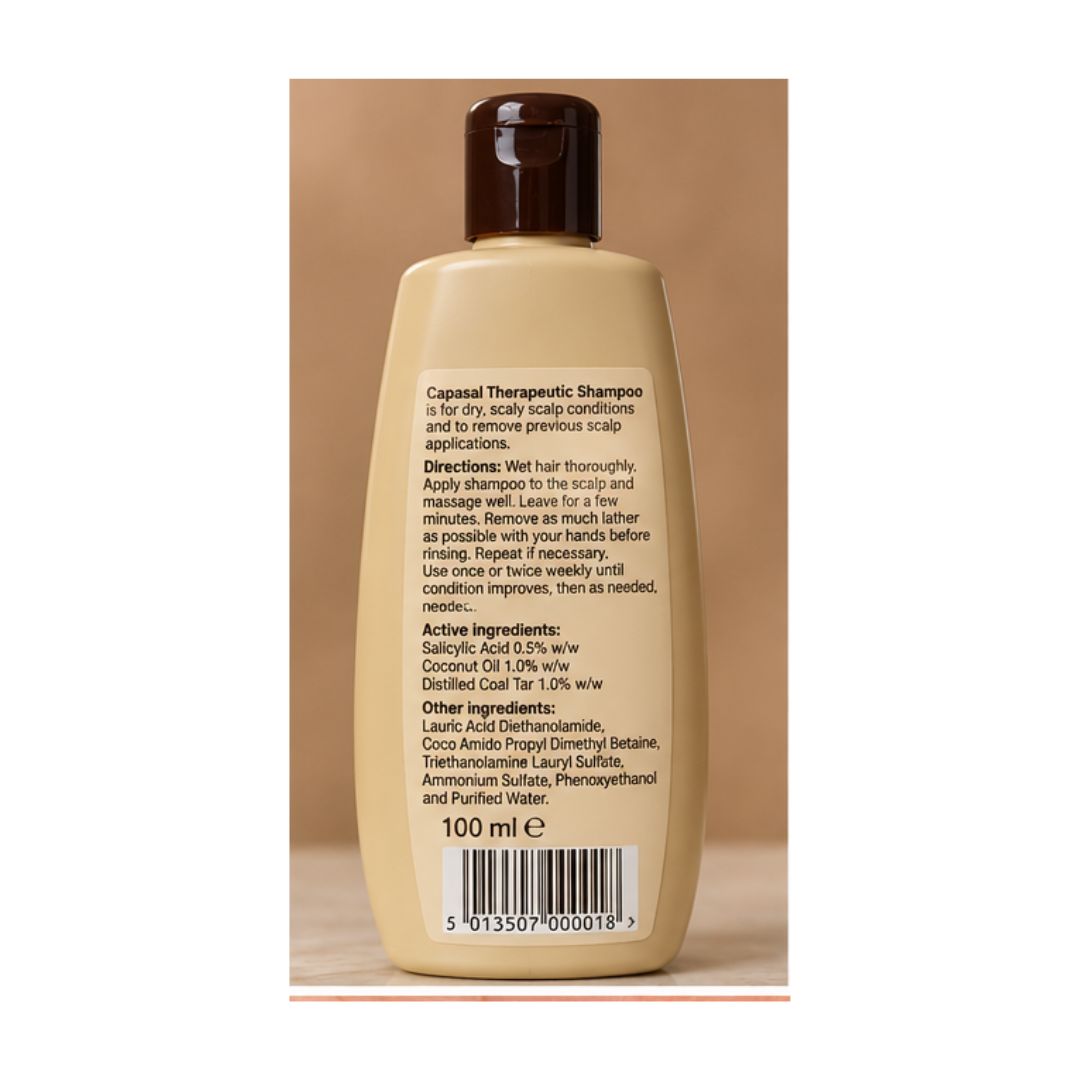 A 100 ml bottle of Capasal Therapeutic Shampoo shown from the back, featuring a beige body, dark brown cap, and printed product information on a brown background.