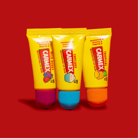 Carmex Minis SPF15 Lip Balm 3 Pack contents on a red background