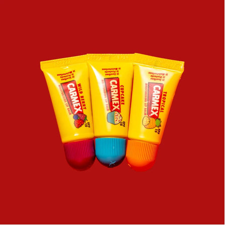 Carmex Minis SPF15 Lip Balm 3 Pack contents on a red background