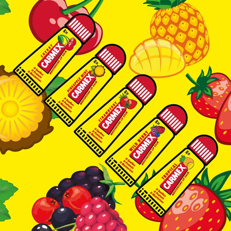 Carmex Minis Lip Balm 5 Pack contents on a yellow fruity background