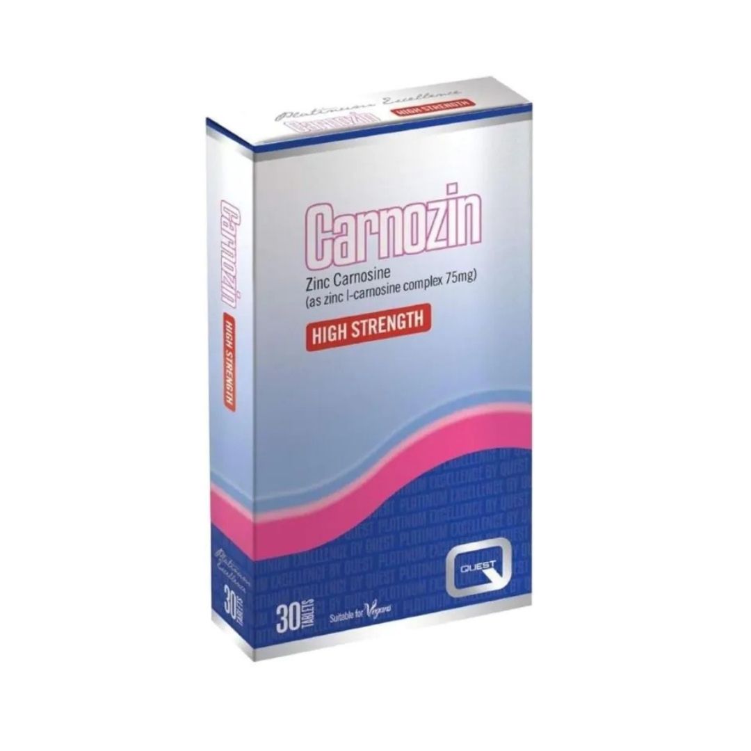 A box of Carnozin High Strength Zinc Carmosine tablets, featuring a silver and blue design with pink accents, on a white background.