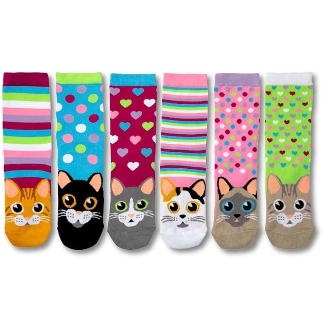 A set of seven colorful crew socks with cat-themed designs, including stripes, polka dots, hearts, and realistic cat faces on the toes, displayed against a plain white background.