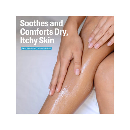 A close-up of a person's leg and hand applying a white cream or lotion to dry, itchy skin, with text reading 'Soothes and Comforts Dry, Itchy Skin' and a small badge that says 'Skin Barrier Strengthening'.