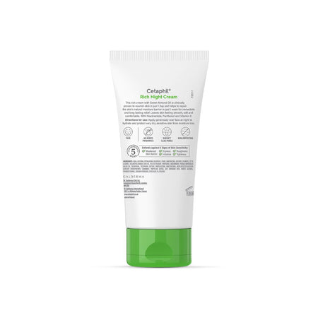 A tube of Cetaphil Rich Night Cream shown from the back, featuring a white body with green and black text and a bright green cap, set against a plain white background.