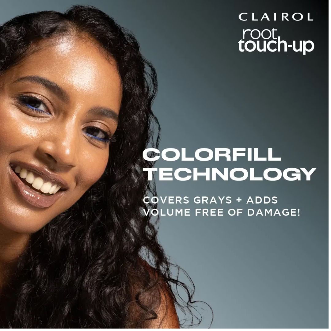 A promotional beauty graphic for Clairol Root Touch-Up Colorfill Technology, showing a smiling woman with long dark wavy hair against a muted blue-gray background with product text.