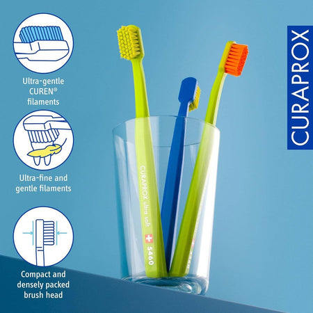 Three Curaprox toothbrushes in a glass with product features highlighted on a blue background.