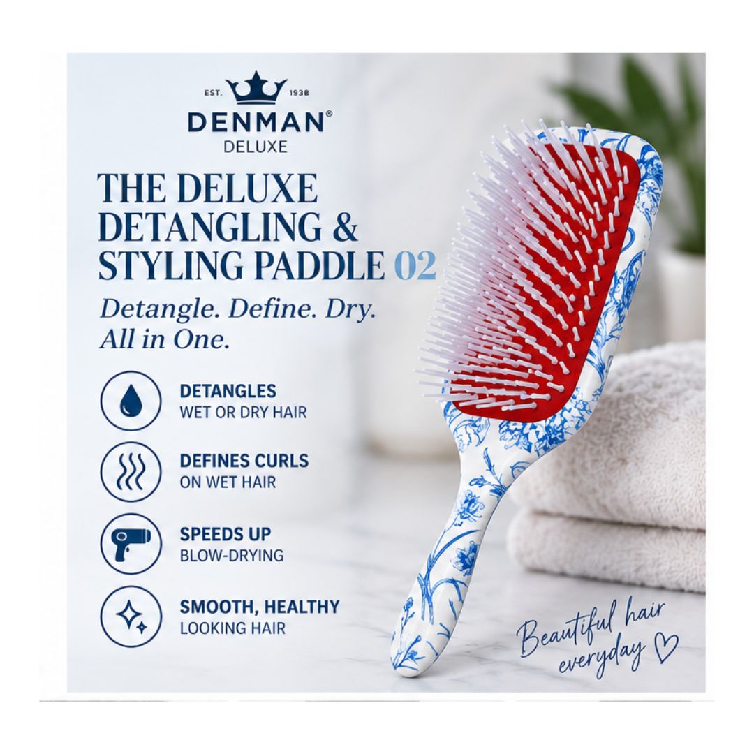 Denman Deluxe Detangling & Styling Paddle on a marble counter top with product details to the left
