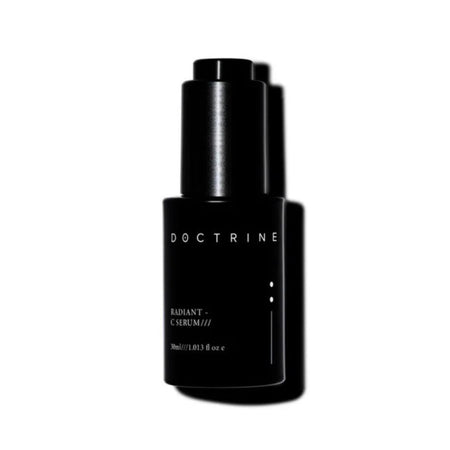 Black bottle with 'Doctrine' branding on a white background