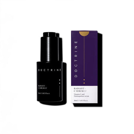 Black serum bottle and purple packaging box with 'Doctrine' branding on a white background