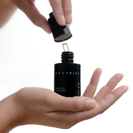 Person applyingDoctrine skincare product to palm