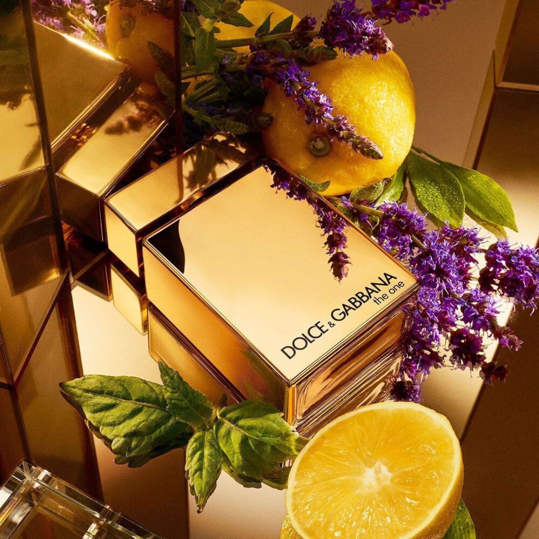 Dolce & Gabbana The One Gold Eau de Parfum on a golden floral background