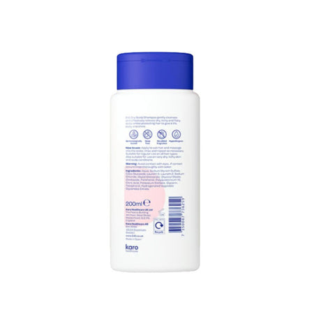 A white plastic bottle of Karo baby shampoo with a blue cap, showing the back label with text and icons on a white background.