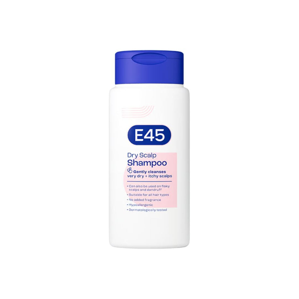 A bottle of E45 Dry Scalp Shampoo with a white body, blue cap, and pink label accent, shown on a plain white background.