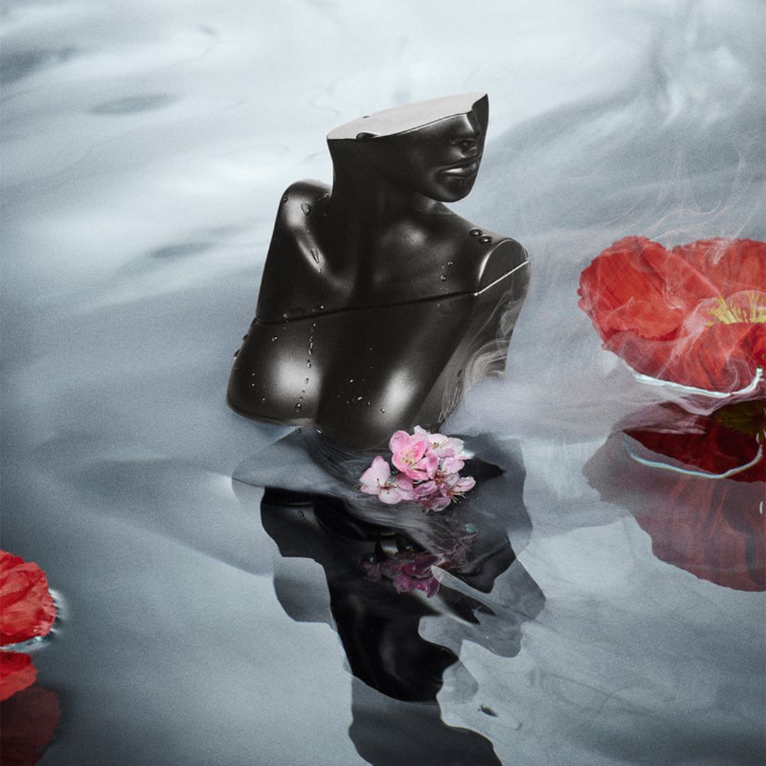 Eilish No. 2 by Billie Eilish Eau de Parfum on a smokey water background with flower petals