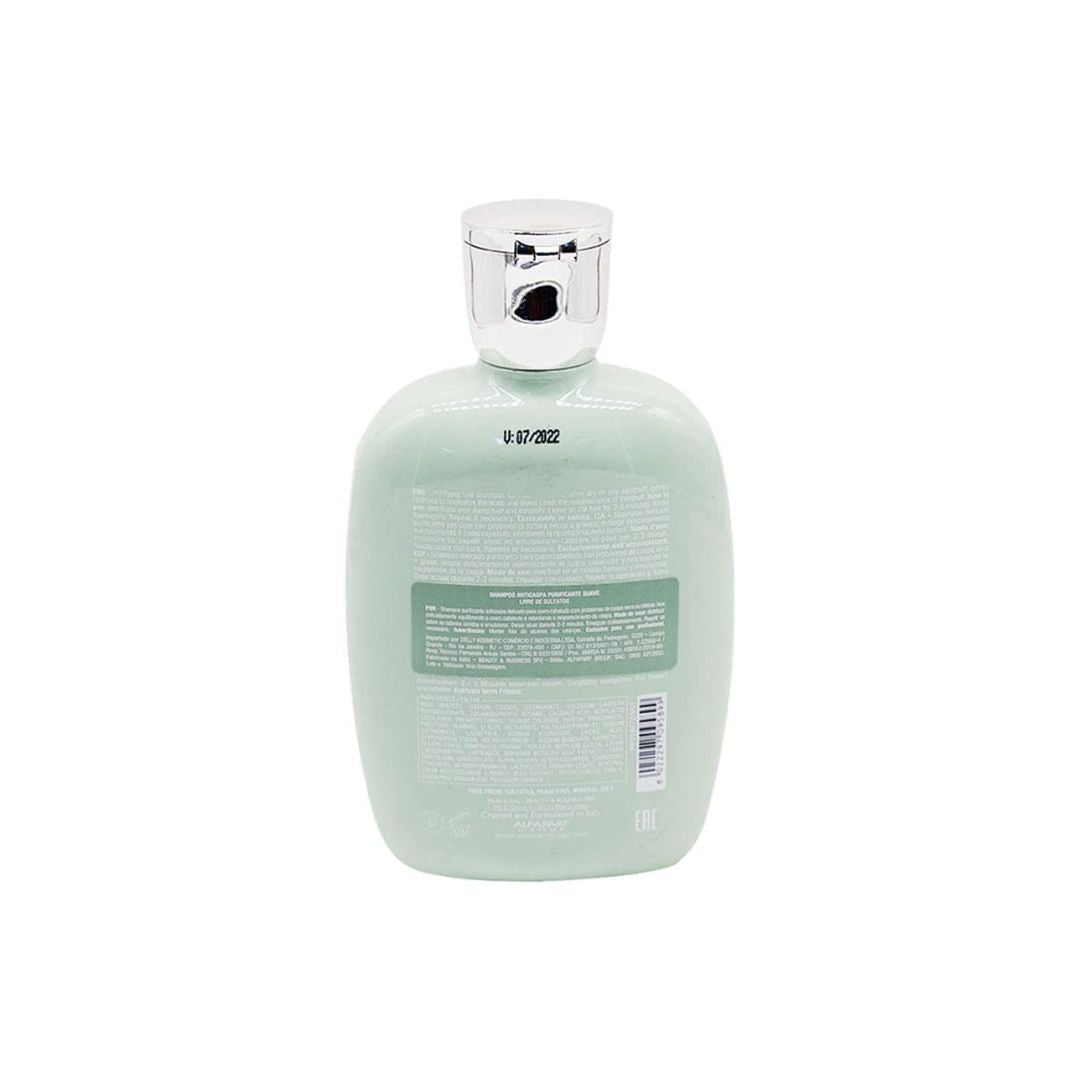 The back view of a light mint green bottle with a shiny silver cap, showing the product's barcode and text on a solid white background.