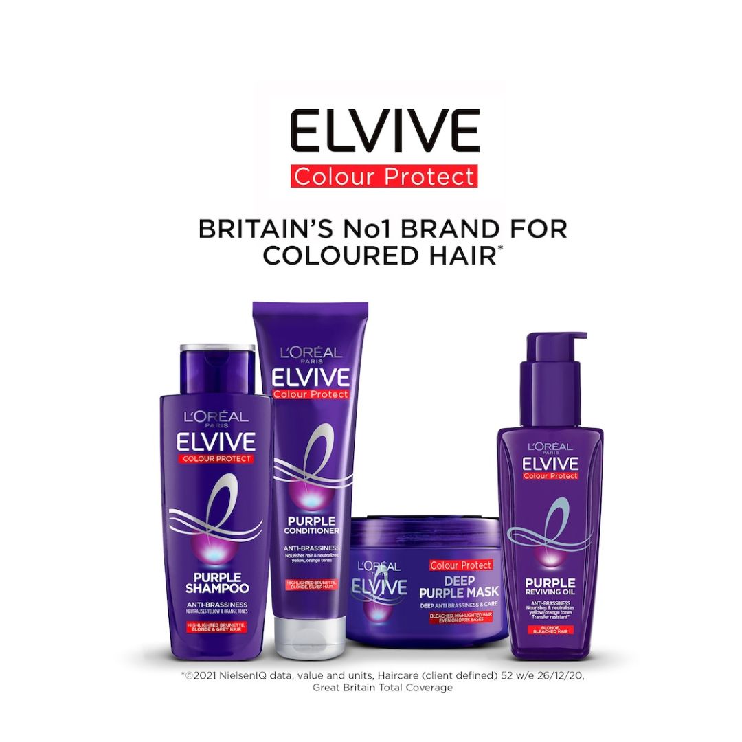 Four L'Oréal Paris Lévisse Elvive Colour Protect hair care products in purple packaging, including a bottle of purple shampoo, a tube of deep purple mask, a jar, and a pump bottle, displayed against a white background with promotional text above.
