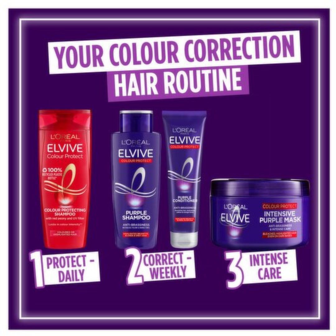 A promotional graphic for L'Oréal Paris Elvive hair color protection routine on a dark purple background. It shows four products arranged in a sequence labeled 1 to 3: a red bottle of Elvive Color Protect shampoo, a dark blue bottle of Elvive Purple Shampoo, a dark blue tube of Elvive Color Corrector, and a dark blue jar of Elvive Intensive Purple Mask, with text reading 'YOUR COLOUR CORRECTION HAIR ROUTINE'.