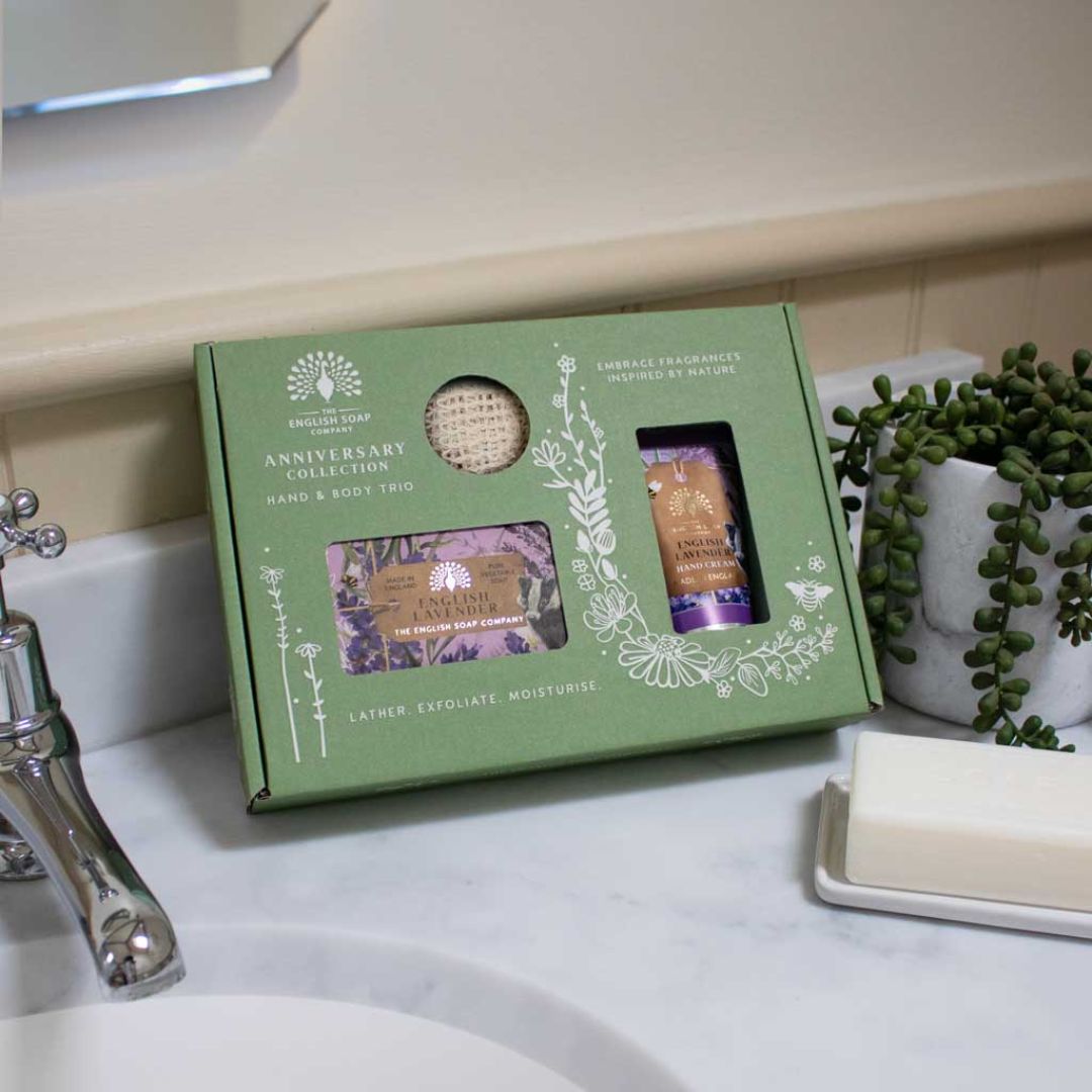 The English Soap Company Lavender Hand & Body Trio on a bathroom sink background