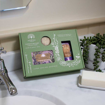 The English Soap Company Lavender Hand & Body Trio on a bathroom sink background
