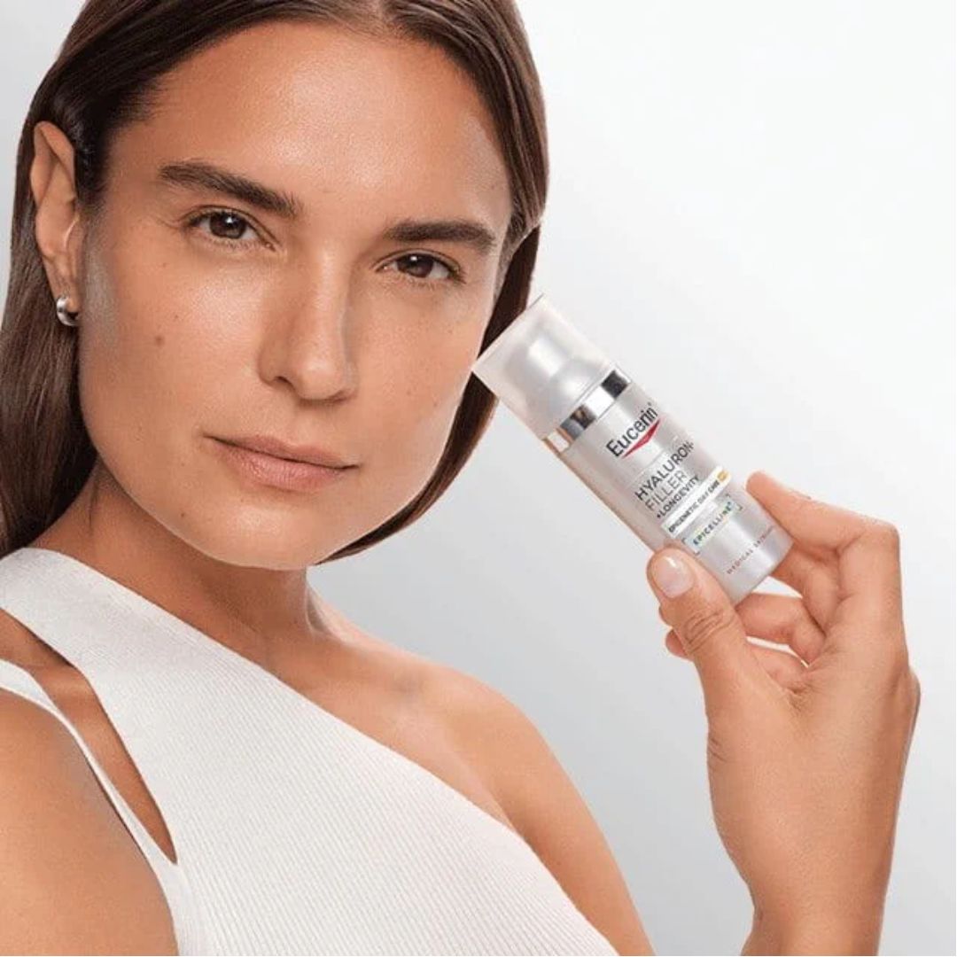 Eucerin Hyaluron-Filler + Longevity Epigenetic Day Care SPF30 being held up by a woman 