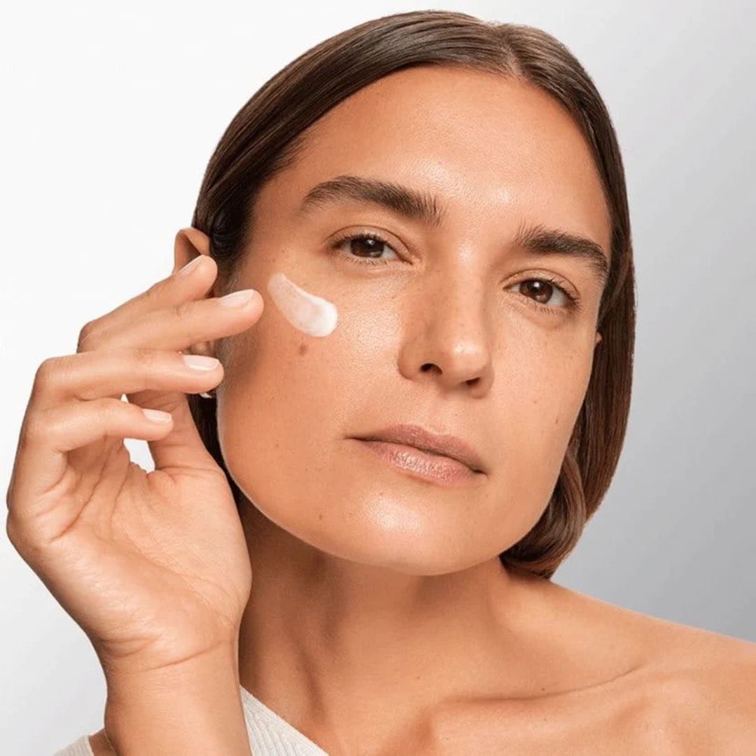 Eucerin Hyaluron-Filler + Longevity Epigenetic Day Care SPF30 being applied by a woman to her cheek