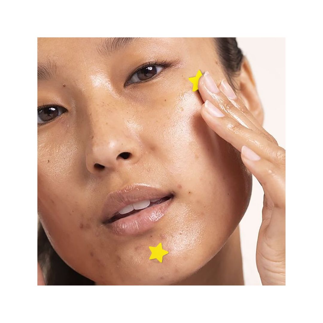 Face Facts Star Blemish Patches promotional image featuring a woman placing one of the patches onto her face