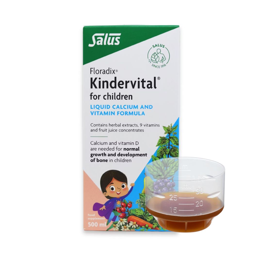 Floradix Kindervital box and measuring cup on a white background