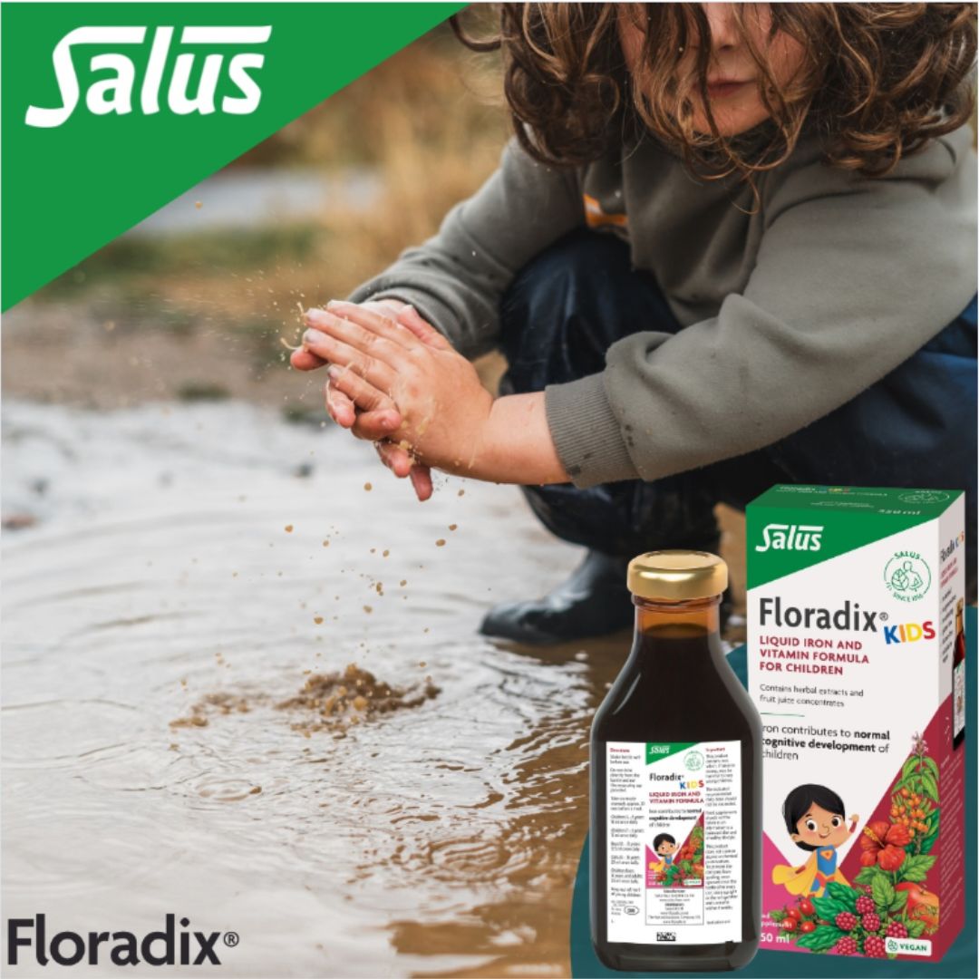 Person playing with water, Salus bottle and box of Floradix Kids in the foreground